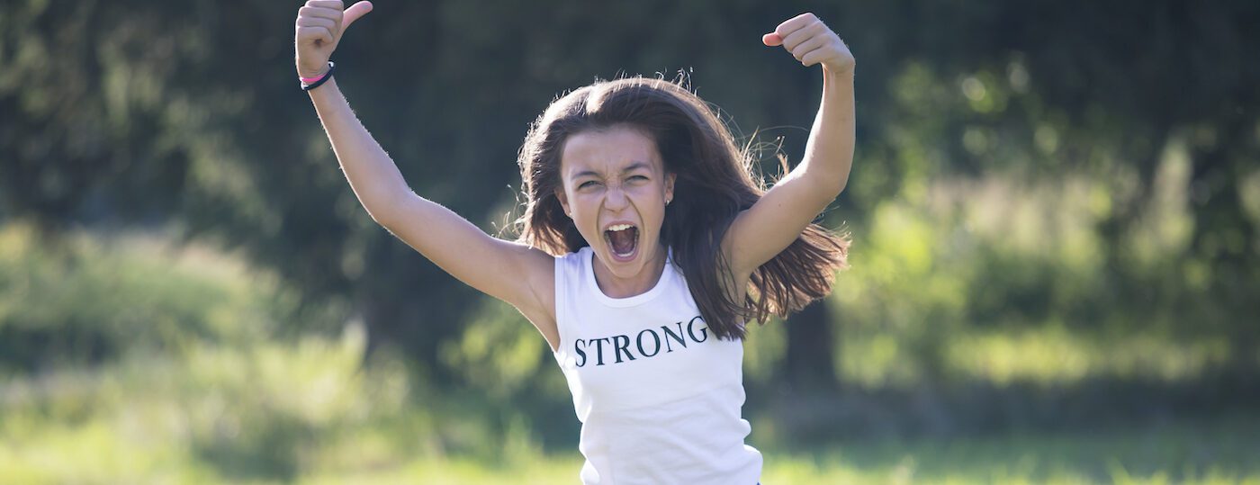 Angry teenage girl. Adolescence, strength, independence. Girl power.